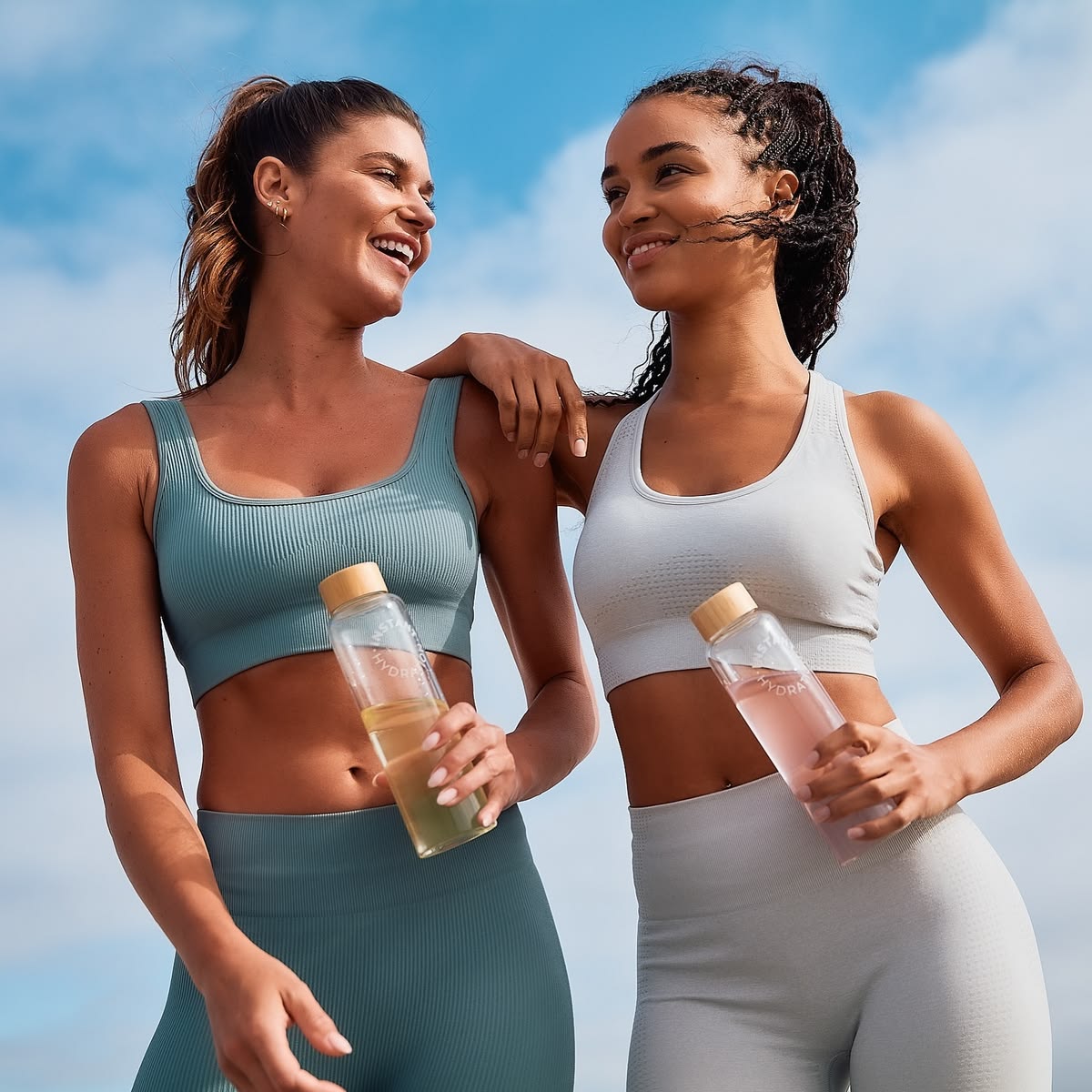 Two friends laughing in activewear